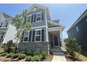 Beautiful two-story home boasting stone accents and a welcoming front porch at 1577 Goldfinch Perch Ln, Knightdale, NC 27545