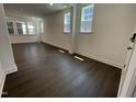 Bright living room featuring hardwood floors, recessed lighting, and large windows at 1577 Goldfinch Perch Ln, Knightdale, NC 27545
