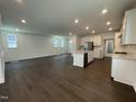 Open concept living space with hardwood floors, recessed lighting, and a gourmet kitchen at 1577 Goldfinch Perch Ln, Knightdale, NC 27545