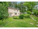 A spacious backyard with lush greenery and a garden area, perfect for outdoor activities at 20 Timberlyne Rd, Chapel Hill, NC 27514