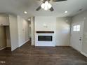 Cozy living room with a modern fireplace, hardwood floors, and recessed lighting for a warm ambiance at 202 S Pearl St, Princeton, NC 27569