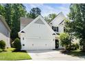 Charming two-story home with white siding, black shutters, and a well-manicured lawn at 3661 Manifest Pl, Cary, NC 27519