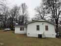 Exterior view of the back of the home and part of the backyard at 6908 Park Pl, Raleigh, NC 27616
