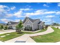 Inviting street view showcasing the home's well-maintained lawn, sidewalk access, and community charm at 1021 Shellbank Dr, Durham, NC 27703