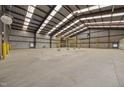 Spacious, empty warehouse featuring metal beams, high ceilings, and concrete floors at 1085 Old Us 421, Lillington, NC 27546