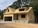 Exterior view of a home under construction, highlighting the initial framing and structure at 109 Arundel Dr, Archer Lodge, NC 27527