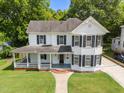 Charming two-story home with a welcoming front porch and well-maintained lawn at 112 Rectory St, Oxford, NC 27565