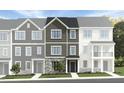 New townhome featuring three stories, Hardie siding, stone accents, and individual entryways at 1420 Jay Rd, Knightdale, NC 27545