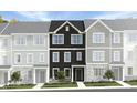 Charming townhome showcasing a dark-colored exterior, complemented by stone accents, and a well-manicured lawn at 1422 Jay Rd, Knightdale, NC 27545