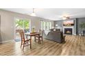 Open living area with a dining table and access to the backyard patio at 2011 Unbridled Dr, Knightdale, NC 27545