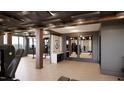 Spacious gym with mirrored walls, exercise equipment, and modern design elements at 2201 W Cornwallis Rd, Durham, NC 27705