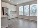 Bright kitchen area with stainless steel appliances, white cabinetry, and ample counter space at 2203 Lambert Rd # 67, Cary, NC 27519