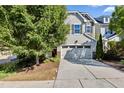 Traditional home with two-car garage, stone accents, and manicured lawn providing pleasing curb appeal at 226 Begen St, Morrisville, NC 27560
