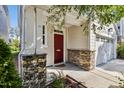 Inviting front entrance featuring a brick-accented porch, red door, and neutral siding at 226 Begen St, Morrisville, NC 27560