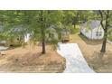 A beautifully landscaped home with a new driveway and well-manicured lawn at 2305 Pinecroft Dv, Burlington, NC 27217