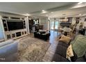 Open-concept living room and dining area boasts hardwood floors and a seamless flow, ideal for entertaining at 2433 Zacks Mill Rd, Angier, NC 27501
