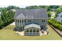 View of the screened-in porch and patio in the backyard at 604 Nottely Pl, Cary, NC 27519