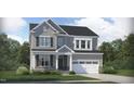Charming two-story home featuring a two-car garage, stone accents, and a well-manicured front lawn at 800 Kinglet House Rd, Knightdale, NC 27545