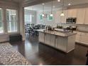 Spacious kitchen features granite countertops, white cabinets, stainless steel appliances, and dining area at 146 Verona Villa Dr, Burlington, NC 27215