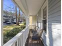 Inviting front porch with seating area perfect for relaxing outdoors and enjoying the neighborhood at 1634 Claiborne Ct, Raleigh, NC 27606