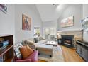 Cozy living room with high ceilings, fireplace, and stylish furnishings perfect for relaxation at 1634 Claiborne Ct, Raleigh, NC 27606