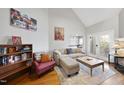 Bright living room featuring a comfortable sofa, area rug, and natural light for a welcoming atmosphere at 1634 Claiborne Ct, Raleigh, NC 27606