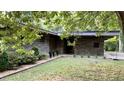A well-maintained stone house featuring mature landscaping at 1846 Hammond St, Rocky Mount, NC 27803