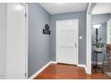 Welcoming entryway with hardwood floors and neutral paint, creating a warm and inviting atmosphere at 202 Howland Ave, Cary, NC 27513