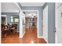 Spacious living room with hardwood floors and a cozy fireplace, perfect for Gathering gatherings at 202 Howland Ave, Cary, NC 27513