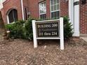 Sign indicates this is Building 200 Condominiums with unit numbers 211 thru 234 at 211 Providence Glen, Chapel Hill, NC 27514