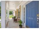 Inviting covered front porch with comfortable seating and a view of the landscaped yard at 2419 Rogerson St, Raleigh, NC 27614