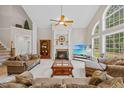 Spacious living room featuring a fireplace, large windows, and ample seating at 2419 Rogerson St, Raleigh, NC 27614