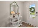 Charming entryway featuring a decorative mirror, a stylish console table, and a welcoming ambiance at 336 Skymont Dr, Holly Springs, NC 27540