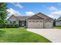 Charming single-story home with a well-manicured lawn and three-car garage at 45 Imperial Dr, Clayton, NC 27527