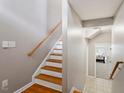 Bright staircase with hardwood treads and neutral walls leading to the upper level at 5003 Celtic Ct, Raleigh, NC 27612