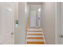 Bright foyer staircase with hardwood treads and light walls at 5003 Celtic Ct, Raleigh, NC 27612