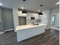 Modern kitchen with white cabinetry, an island and stainless steel appliances at 508 Yeowell Dr, Chapel Hill, NC 27514