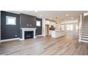 Bright living room with fireplace and open access to modern white kitchen at 510 Yeowell Dr, Chapel Hill, NC 27514