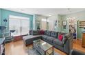 Spacious living room with a large sectional sofa and plenty of natural light at 8620 Neuse Club Ln # 107, Raleigh, NC 27616