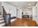 Grand foyer with hardwood floors, staircase, and a view of the elegant dining room at 1217 Chalk Maple Dr, Cary, NC 27519
