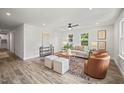 Bright and modern living room featuring recessed lighting, wood floors and stylish furnishings at 1621 N Park Ave, Burlington, NC 27217