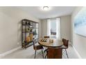Cozy game room featuring a wood table, four chairs, and a stylish shelving unit at 2019 Kapalua Way # 200, Durham, NC 27703