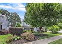 Charming two-story home with a beautifully landscaped front yard and mature trees at 237 Bendemeer Ln, Rolesville, NC 27571