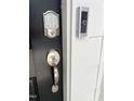 The front door has a digital keypad and a video doorbell for added security at 3103 White Blossom Ct, Raleigh, NC 27610