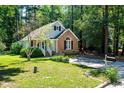 Exterior view of home with a well-manicured lawn, mature trees, and a mailbox on a sunny day at 3616 Culater Ct, Raleigh, NC 27616