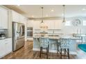 Well-equipped kitchen with stainless steel appliances, granite countertops, and a center island at 40 Two Creeks Loop, Chapel Hill, NC 27517