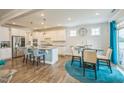 Open-concept kitchen with granite countertops, stainless steel appliances, and breakfast bar seating at 40 Two Creeks Loop, Chapel Hill, NC 27517