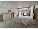 Large living room under construction, featuring drywall work, window and a Personal doing electrical work at 4024 N Nc 581 Hwy, Kenly, NC 27542