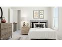 Cozy bedroom features a comfortable bed, stylish nightstands, and tasteful décor at 5649 Cayden Cove Dr, Wendell, NC 27591