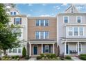 Exterior view of the townhome, highlighting the brick facade, covered entrance, and tidy front landscaping at 6107 Kayton St, Raleigh, NC 27616